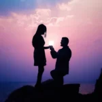 Silhouette of a romantic proposal at the ocean during a purple and pink sunset with the ring aligned with the glowing sun wallpaper