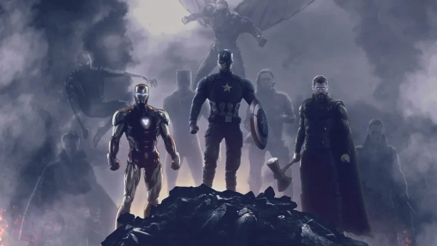 The Avengers team standing united on a smoky battlefield with Captain America, Iron Man and Thor in dramatic cinematic lighting wallpaper
