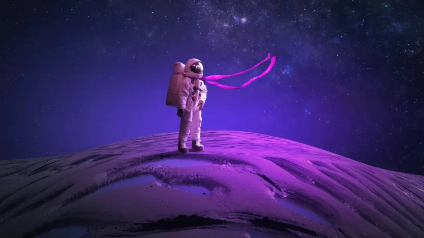 astronaut standing on alien planet with purple galaxy sky wallpaper