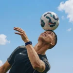 cristiano ronaldo balancing football on head skill outdoor sky soccer athlete wallpaper