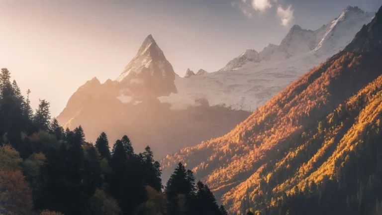 golden autumn mountain landscape with snowy peaks and sunrise light wallpaper