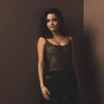 rachel zegler minimal studio portrait soft lighting elegant black dress aesthetic wallpaper