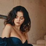 selena gomez elegant off shoulder portrait with soft lighting aesthetic wallpaper