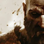 Close-up of Kratos from God of War with red war paint and intense warrior expression wallpaper