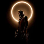 Marvel Star Lord standing beneath a glowing eclipse ring in a dark cosmic sci fi scene with futuristic armor wallpaper