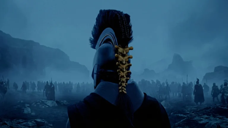 Ancient armored warrior overlooking a dark cinematic battlefield in blue fog wallpaper