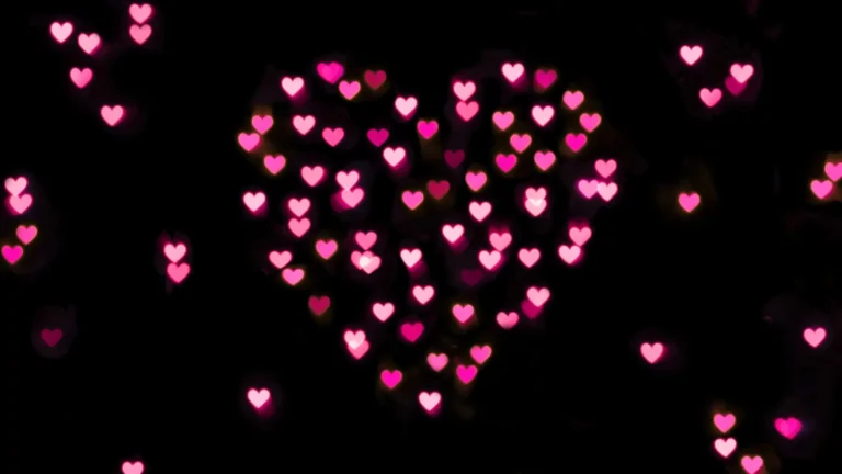 Pink glowing heart bokeh lights on dark romantic background wallpaper