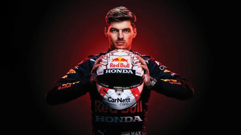 Max Verstappen holding his Red Bull Racing Formula One helmet in a dramatic championship portrait wallpaper