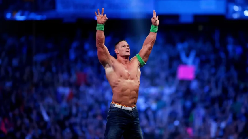 John Cena celebrating with his iconic Never Give Up pose inside a WWE arena in Ultra HD wallpaper