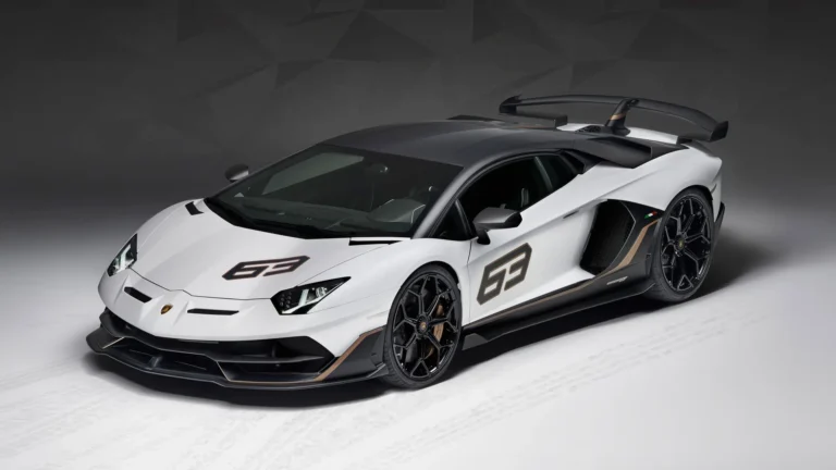 White Lamborghini Aventador SVJ 63 Edition with carbon fiber accents and large rear wing in a studio setting UHD wallpaper