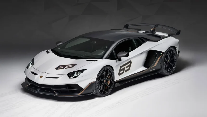 White Lamborghini Aventador SVJ 63 Edition with carbon fiber accents and large rear wing in a studio setting UHD wallpaper
