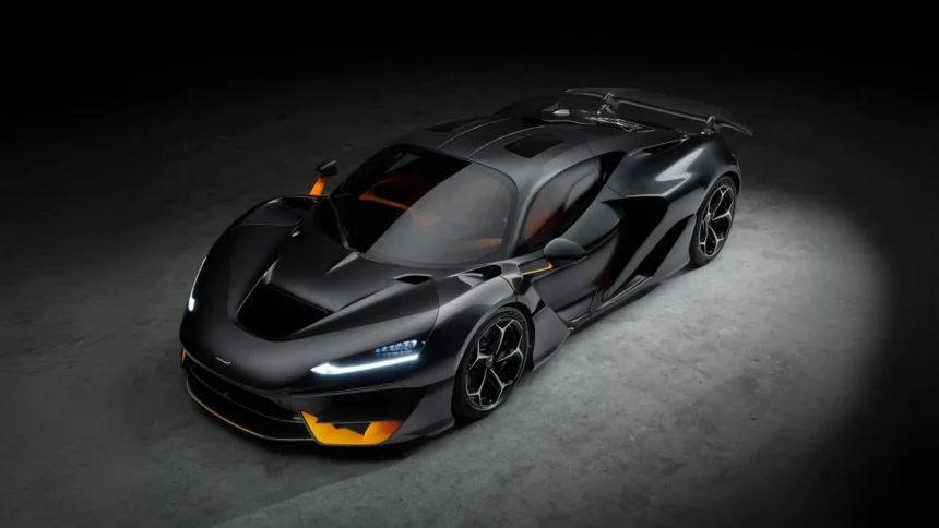 Black McLaren W1 hypercar with carbon fiber body and active rear wing viewed from above UHD wallpaper