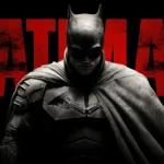 The Batman standing in front of the iconic red Batman logo in a cinematic DC superhero poster UHD wallpaper