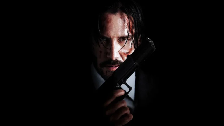 John Wick Baba Yaga holding pistol with battle scars in dark cinematic portrait UHD wallpaper