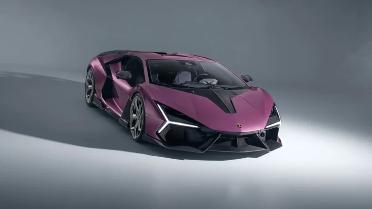 Purple Lamborghini Revuelto with carbon fiber details and aggressive aerodynamic styling in a modern studio wallpaper.