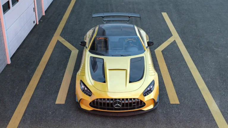 Yellow Mercedes AMG GT Black Series viewed from above with carbon fiber hood details, aggressive front grille, and large rear wing wallpaper.