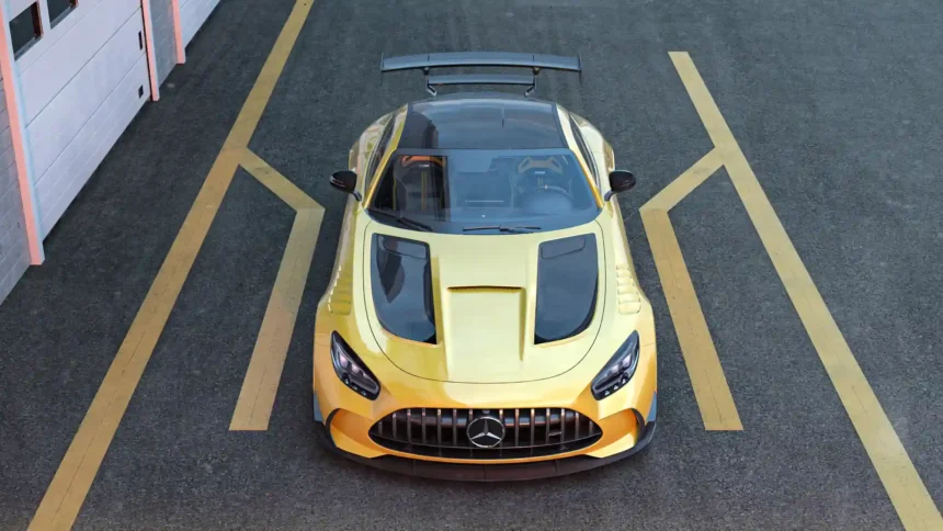 Yellow Mercedes AMG GT Black Series viewed from above with carbon fiber hood details, aggressive front grille, and large rear wing wallpaper.
