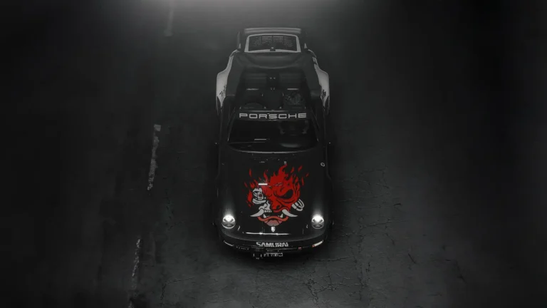Cyberpunk 2077 Porsche 911 Samurai Edition viewed from above, featuring a black Porsche with a fiery red Samurai demon logo on the hood, glowing headlights, and a large rear spoiler on dark asphalt wallpaper.