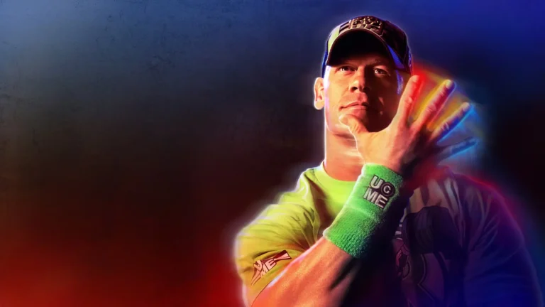 John Cena WWE 2K23 performing his iconic You Can't See Me hand gesture wearing a green wristband and cap against a dramatic red and blue neon background wallpaper.